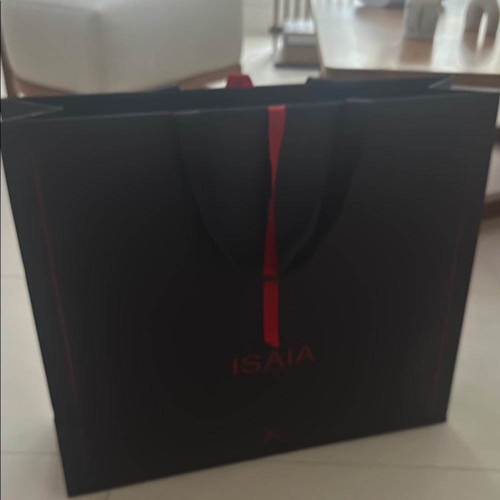 Beautifully isaia paper bag with tie ribbon.